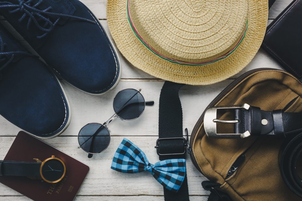 top view accessoires to travel with man clothing concept. bow ti